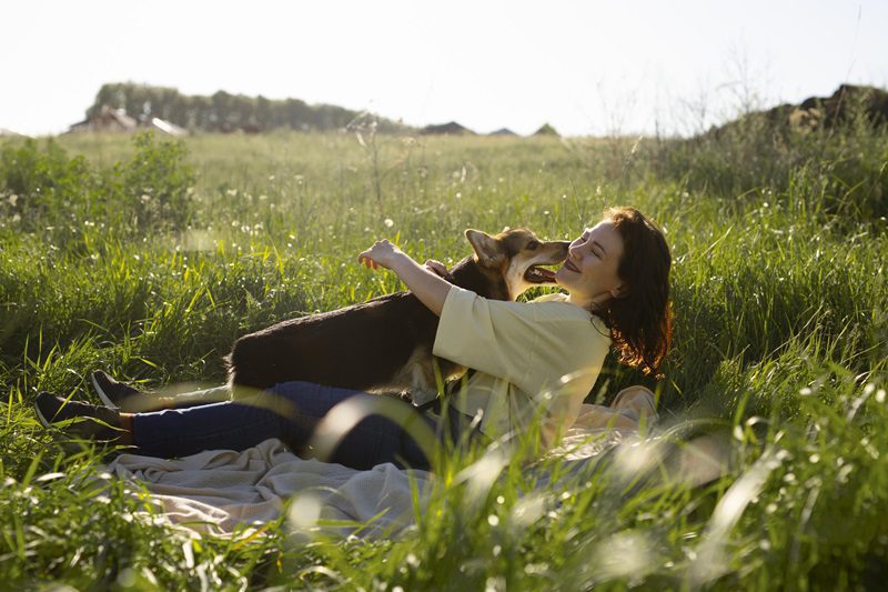 full-shot-woman-with-dog-nature